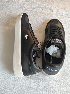 Lacoste Black Sneakers with White Sole. 13